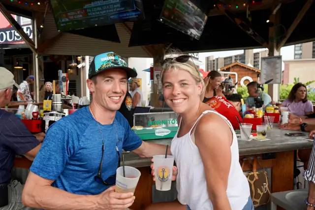 A couple toasting crushes at the outdoor bar